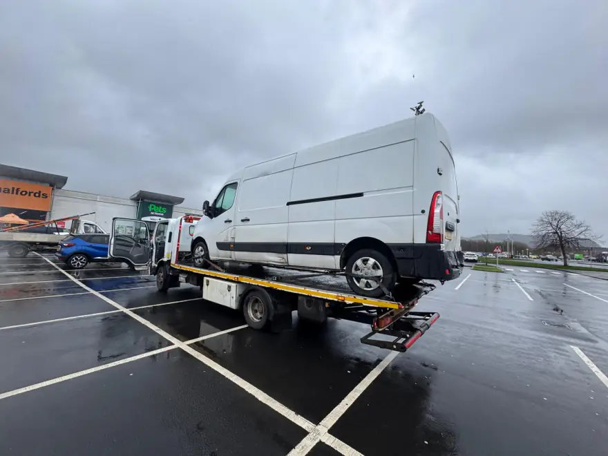 Burnside Recovery loading a van from a car park in the wet
