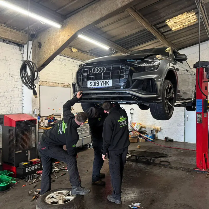 Wheel removed for brake work at Burnside Motors, Dumbarton Road