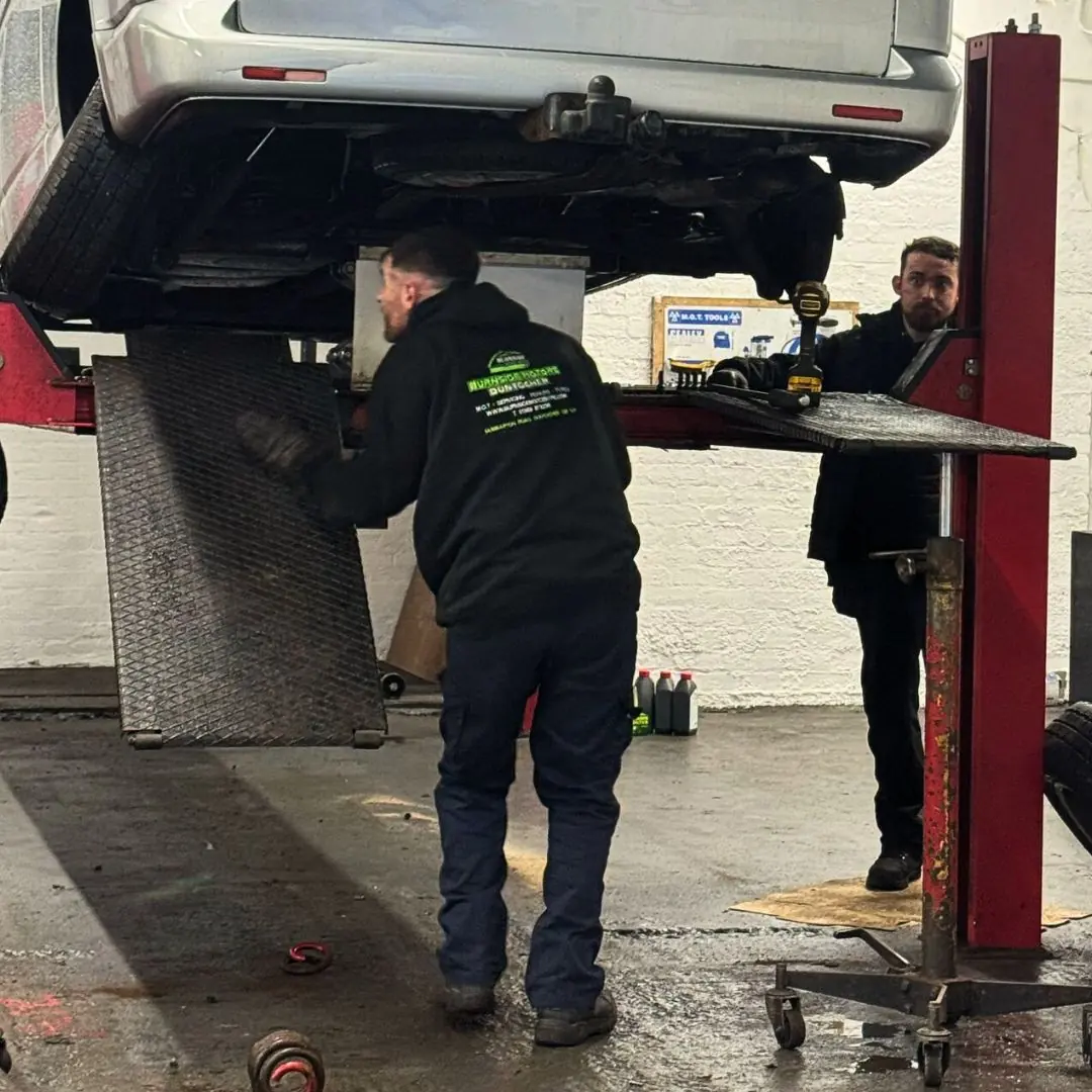 Technicians working on a vehicle at Burnside Motors