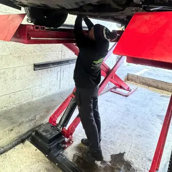 Brake and exhaust repairs on a vehicle underbody at Burnside Motors